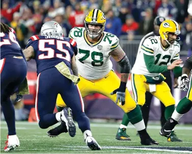  ?? Winslow Townson/AP Images for Panini ?? ■ Green Bay Packers offensive tackle Jason Spriggs moves in for a block against the New England Patriots on Nov. 4 at Gillette Stadium in Foxborough, Mass. Protecting quarterbac­k Aaron Rodgers will be of the utmost importance for the Packers when they face the Chicago Bears and their NFC-best defense on Sunday.