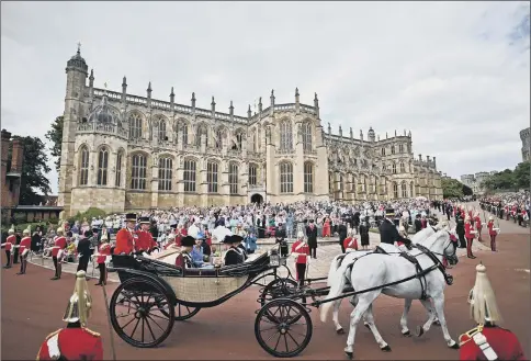  ?? ?? CEREMONIAL: The main Royal party travels by carriage as they leave St George’s Chapel after attending the Order of the Garter ceremony. Top right, the Duke and Duchess of Cambridge. Above right, Sir Tony Blair.