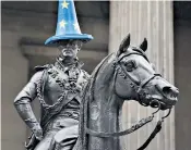  ??  ?? An Eu-themed cone is placed on the Duke of Wellington’s statue in Glasgow, which voted Remain, yesterday