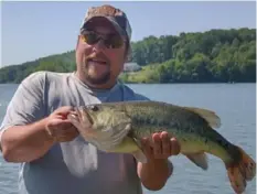  ?? Michael Stazko ?? Michael Stazko of Pittsburgh released this 24-inch largemouth bass taken on a soft plastic lure at Lake Arthur on June 5.