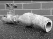  ??  ?? Officials on March 9 display an example of the lead pipes in Galesburg, Ill. In Galesburg, lead levels have exceeded the federal standard in 22 out of 30 testing periods since 1992.