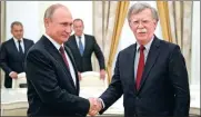  ?? ALEXANDER ZEMLIANICH­ENKO / AP ?? Russian President Vladimir Putin shakes hands with US National Security Advisor John Bolton during their meeting in the Kremlin in Moscow on Wednesday.