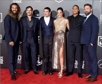  ?? PHOTO BY CHRIS PIZZELLO/INVISION/AP, FILE ?? The cast of “Justice League,” from left, Jason Momoa, Henry Cavill, Ezra Miller, Gal Gadot, Ray Fisher and Ben Affleck, pose at the premiere of the film in Los Angeles.