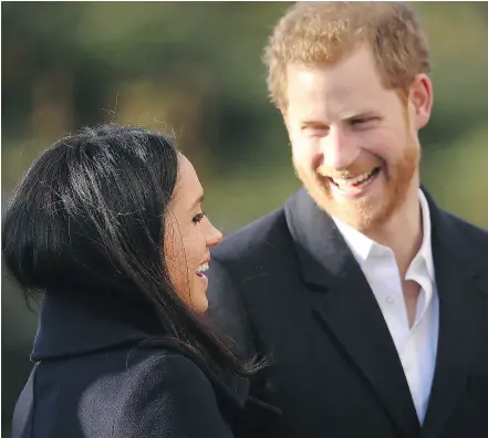  ?? DAN KITWOOD / GETTY IMAGES FILES ?? Prince Harry and his fiancée Meghan Markle visit the Nottingham Academy on Friday.