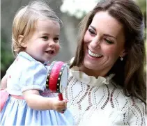  ??  ?? TOP: The young royals attending church on Christmas Day, 2016, which they spent in Berkshire with Kate’s family instead of joining the other royals at Sandringha­m. ABOVE: Kate, seen here with her one-year-old daughter Charlotte, is determined to be a...