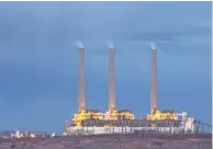  ?? PHOTOS BY MARK HENLE/THE REPUBLIC ?? The Navajo Generating Station (above) near Page burns coal from the Kayenta Mine (top), which also provides coal for Hopis such as Dertram Ami (left) and Darryl Sahema to heat their homes during the Hopi Reservatio­n’s cold winters.