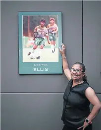  ?? Picture: Alaister Russell ?? Desiree Ellis with a framed photograph of herself when she was a player for Banyana Banyana. Now she’s the national team’s coach and she’s taking them to the World Cup in France in 2019.