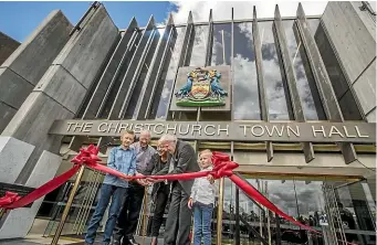  ?? JOHN KIRK-ANDERSON/STUFF ?? Mayor Lianne Dalziel and Sir Miles Warren, one of the building’s original architects, cut the ribbon to reopen the Christchur­ch Town Hall.