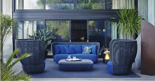  ??  ?? FROM TOP The Bay sofa in a shade that mimics the colour of the sea; the designers Nipa Doshi and Jonathan Levien; Bay armchairs in nature’s hues echo subtle elegance