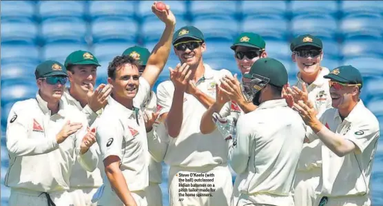  ?? AFP ?? Steve O’Keefe (with the ball) outclassed Indian batsmen on a pitch tailormade for the home spinners.