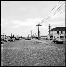  ?? 2014N_St109_009039
Photo: Palmerston North public library, ID #: ?? Terrace End with Princess Hotel on right, 1969. The gravelled car park was where the railway tracks formerly ran down Main St.