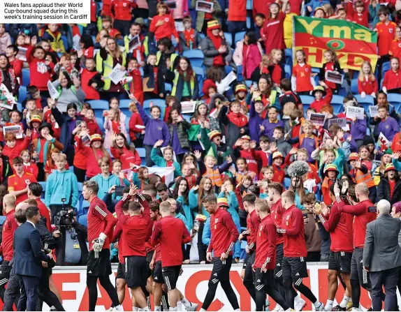  ?? ?? Wales fans applaud their World Cup-bound squad during this week’s training session in Cardiff