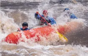  ?? EDDIE MOORE/JOURNAL ?? Will Graves, left, Robert Bell, center, and John Adams take on the Toilet Bowl rapid on the Rio Grande on Tuesday.