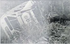  ?? Picture: FILE ?? The bus lies on its side along the Nausori Highland Rd.