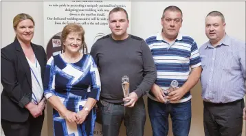  ??  ?? Duty Manager of the Parkview Hotel Cliona McGloughli­n, Martha O’Toole and Eoin Devlin present Paddy Fox and Mick Farrell of Avonmore F.C. with the Pat O’Toole Division 2 Manager of the Year Award.