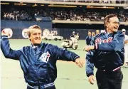  ?? FRED CHARTRAND / THE CANADIAN PRESS FILES ?? Then-prime minister Brian Mulroney and U.S. president George H.W. Bush throw out the opening pitch at the Toronto Blue Jays home opener in April 1990.