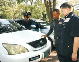  ??  ?? ... Bukit Aman Criminal Investigat­ion Department director Commission­er Datuk Seri Wan Ahmad Najmuddin Mohd (right) with Royal Thai Police adviser Gen Witaya Prayongpan inspecting 20 stolen cars from Malaysia during a handover ceremony of the vehicles...