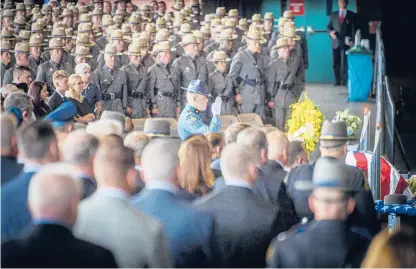  ?? MARK MIRKO PHOTOS/THE HARTFORD COURANT ?? A Maine state trooper salutes the casket of Connecticu­t State Police Sgt. Brian Mohl during funeral services Thursday at Xfinity Theatre. Mohl, a 26-year Connecticu­t State Police veteran, died Sept. 2 during flooding from Ida while on duty in Woodbury.