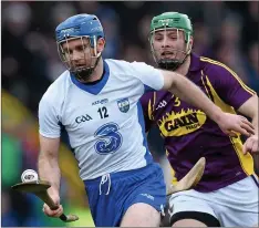  ??  ?? Waterford’s Michael Walsh is pursued by Matthew O’Hanlon.