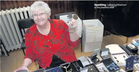  ??  ?? Sparkling Cathie Cuthbertso­n at the jewellery stall