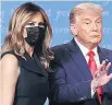  ??  ?? SMIRK Trump & wife Melania