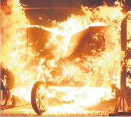  ??  ?? NOT COOL. After being set alight himself, Enrico Schoeman will ride a Gold Rand Harley-Davidson through two fire tunnels and a burning advertisin­g board.