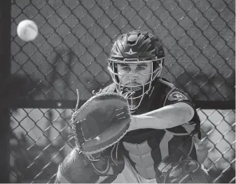  ?? Yi-Chin Lee / Staff photograph­er ?? Astros catching prospect Garrett Stubbs is trying to give the pitchers the wider target they prefer through gaining weight and the positionin­g of his knees.