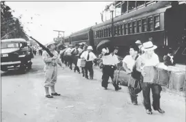  ?? NATIONAL JAPANESE AMERICAN HISTORICAL SOCIETY VIA AP ?? Japanese-Latin Americans en route to internment camps during World War II.
