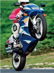  ?? ?? Above: What to do with a 1996 RGV250P? Wheelie it, of course