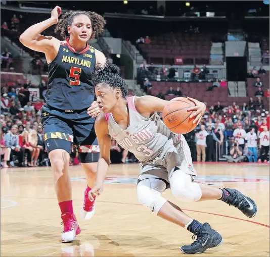  ?? [BARBARA J. PERENIC/DISPATCH] ?? The Buckeyes’ Kelsey Mitchell, who scored 31 points, drives past Destiny Slocum of Maryland.