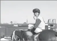  ?? The Sentinel-Record/Rebekah Hedges ?? OVER THE RAINBOW: Jockey Channing Hill celebrates Friday at Oaklawn Park after winning the $100,000 Rainbow Stakes for 3-year-old Arkansas-bred colts and geldings with Hoonani Road. Hill is the son-in-law of the gelding’s trainer, Wayne Catalano.