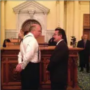  ?? MICHAEL CATALINI — THE ASSOCIATED PRESS ?? Democratic Senate President Steve Sweeney, left, and Democratic Assembly Speaker Vincent Prieto speak on the floor of the Assembly shortly before the deadline to pass a budget Friday in Trenton, N.J. Sweeney and Prieto are at odds over whether to...