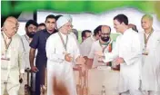  ?? PTI ?? Congress President Rahul Gandhi interacts with former Prime Minister Dr Manmohan Singh during 'Jan Akrosh Rally', in Delhi on Sunday