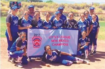  ?? PATRICK NEWELL/JOURNAL ?? Westgate’s girls pose Sunday afternoon after winning the District 9 Little League Softball championsh­ip at Petroglyph Park. Up next is a trip to Waco, Texas.