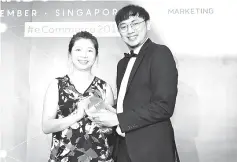  ??  ?? AirAsia BIG Loyalty Head of Branding and Creative Cheng Ling Wei (right) accepting the Best eCommerce Merchant (Travel/Hospitalit­y) award from panel judge Anny Huang, who is NTUC Income Head of eCommerce.