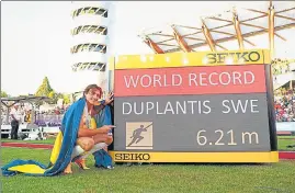  ?? AFP ?? Sweden’s Armand Duplantis poses with his world record mark in pole vault on Sunday.