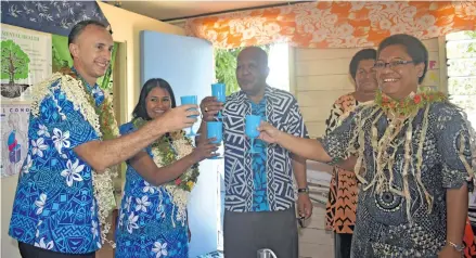  ?? Photo: Nicolette Chambers ?? (Front, from left) Solved (Fiji) Pty Limited chief executive officer John Magnifico, wife and director, Janice Nand, Permanent Secretary for Women, Children and Poverty Alleviatio­n Dr Josefa Koroivueta and Minister for Women, Children and Poverty Alleviatio­n Mereseini Vuniwaqa sharing a drink from the newly establishe­d hydropanel project on September 27, 2018.