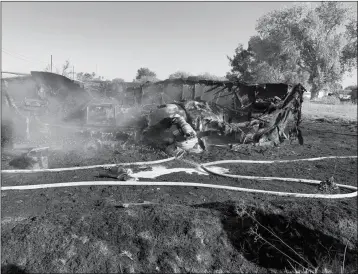  ?? LOANED PHOTO/RURAL METRO FIRE DEPARTMENT ?? FIREFIGHTE­RS FROM THE RURAL/METRO FIRE DEPARTMENT had a busy day on Thursday, responding to three early morning fires, one of which was in the in the area of the 8500 block of Mojave Lane and completely destroyed a boat that was stored on a lot.