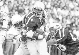  ?? Texas A&M Athletics ?? Before he began fighting for yardage at Texas A&M in the 1970s, running back Bubba Bean, center, was the subject of an intense recruiting battle between the Aggies, Colorado and other schools beating a path to his home in Kirbyville.