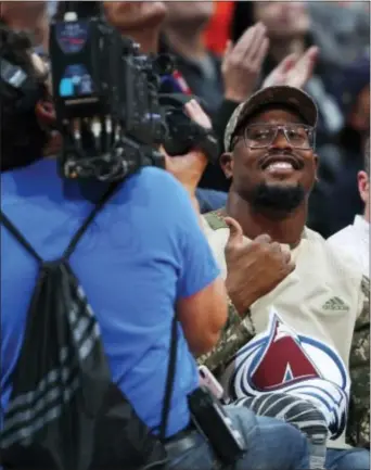  ?? DAVID ZALUBOWSKI — THE ASSOCIATED PRESS ?? That grinning guy wearing a funky Colorado Avalanche shirt at a Denver Nuggets game Wednesday night was none other than Broncos linebacker Von Miller ... who isn’t such a friendly looking fan on football game days.