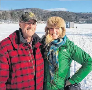  ?? AP PHOTO ?? This Jan. 26, 2014 photo shows Kelly Will in Stoneham, Maine, with Rod Rovzar, who took her ice fishing. Will visited Stoneham as part of a year-long trip to see the 50 states by visiting with locals and immersing herself in communitie­s.