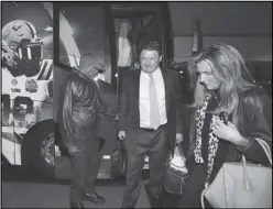  ?? Associated Press ?? ARRIVAL — LSU head coach Ed Orgeron and his wife Kelly arrive with the team for the CFP Peach Bowl on Sunday in Atlanta. LSU takes on Oklahoma in the Peach Bowl on Saturday.