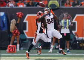  ?? AP PHOTO ?? Denver Broncos wide receiver Demaryius Thomas (88) catches a touchdown pass against Cincinnati Bengals cornerback Chris Lewis-Harris.