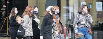  ?? PHOTO: CHRISTINE O’CONNOR ?? Masked up . . . Shoppers in George St were wearing masks on the first day of Alert Level 2 restrictio­ns yesterday.