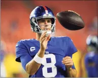  ?? Alex Brandon / Associated Press ?? New York Giants quarterbac­k Daniel Jones is tossed a football during warmups before the start of a game against the Washington Football Team on Sept. 16.
