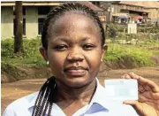  ?? /Reuters ?? No match: Student Stephanie Mbafumoja holds her voter identity card, which she says began to fade within weeks.