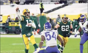  ?? Mike Roemer / Associated Press ?? Green Bay Packers quarterbac­k Aaron Rodgers passes during the second half of an NFL divisional playoff game against the Los Angeles Rams Saturday in Green Bay.