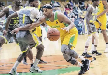  ?? Jim franco / Special to the times union ?? Albany guard Lloyd Johnson drives to the basket against new York during their game on Saturday at Washington Avenue Armory. Johnson led the Patroons with 28 points.