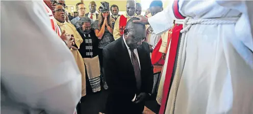  ?? Picture: Thulani Mbele ?? Deputy President Cyril Ramaphosa, running for leadership of the ANC, receives a blessing at the Evangelica­l Lutheran Church in Chiawelo, Soweto.