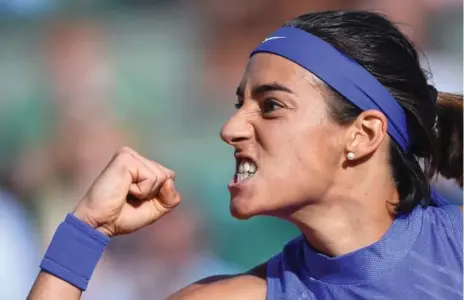  ?? FRANCOIS XAVIER MARIT/AFP/GETTY IMAGES ?? Caroline Garcia, seeded 28th, reacts after wrapping up her fourth-round win in an all-French encounter with Alize Cornet at Roland Garros on Monday.